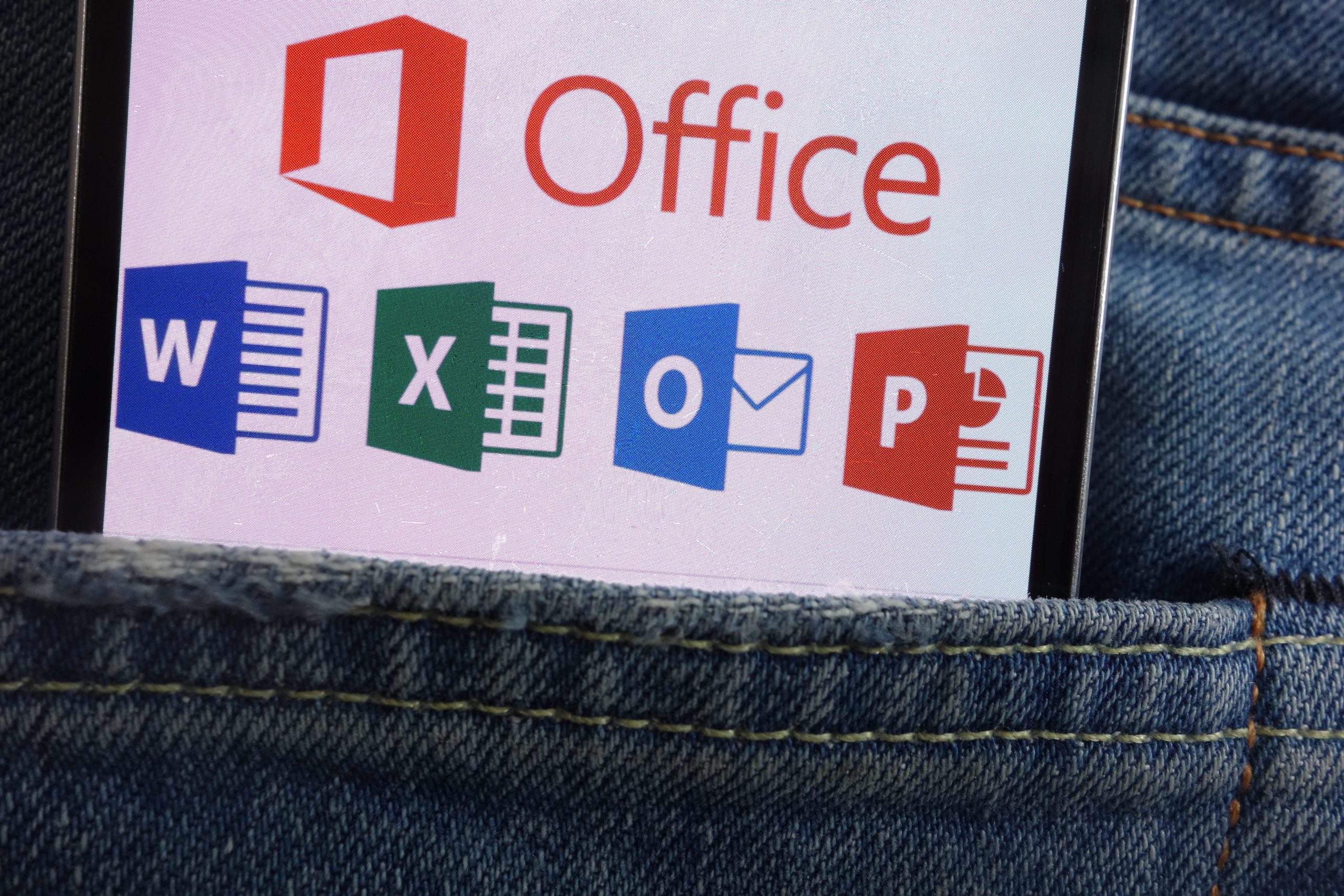 KONSKIE, POLAND - JUNE 01, 2018: Microsoft Office logo displayed on smartphone hidden in jeans pocket