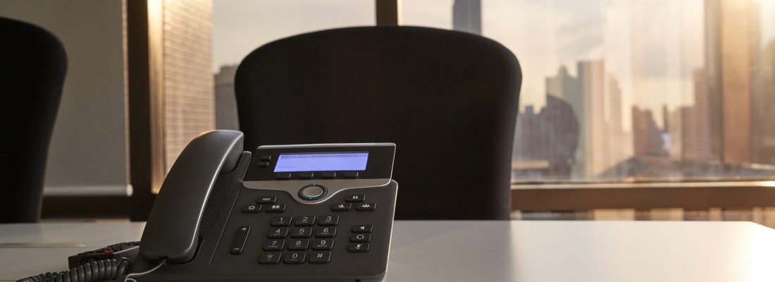 scenic of voip phone in meeting room and sun light from window