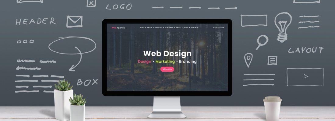 Web design concept with computer display, web theme and drawings of website, app parts. Modern design web page on computer display. Office, studio work desk.