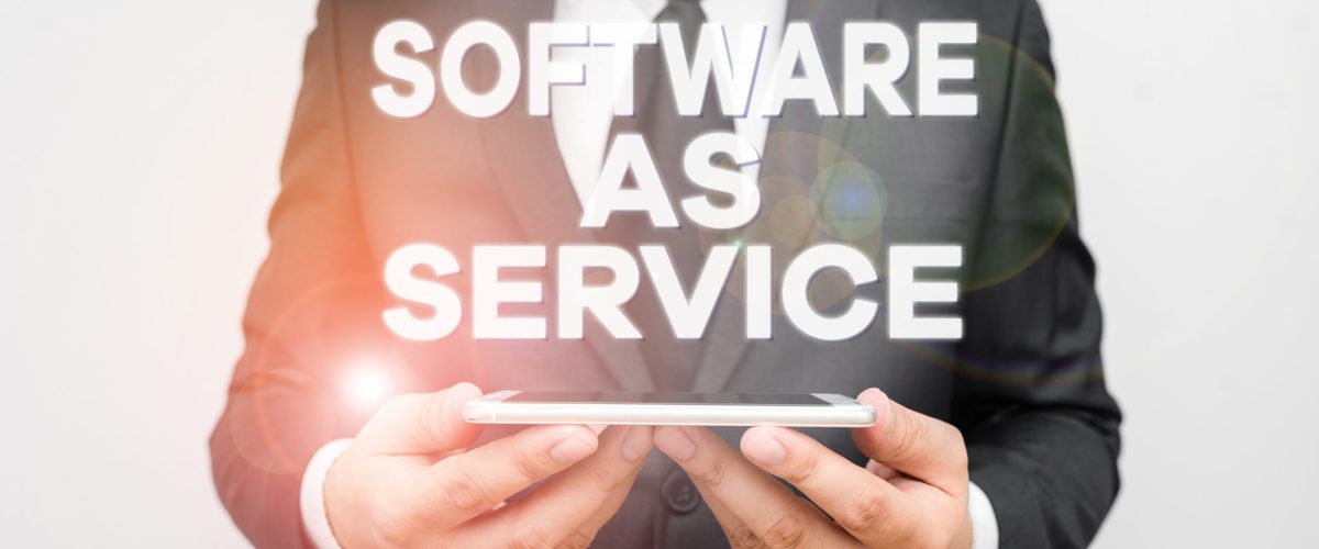 Text sign showing Software As Service. Business photo text On Deanalysisd licensed on Subscription and centrally hosted Male human wear formal work suit hold smart hi tech smartphone use hands